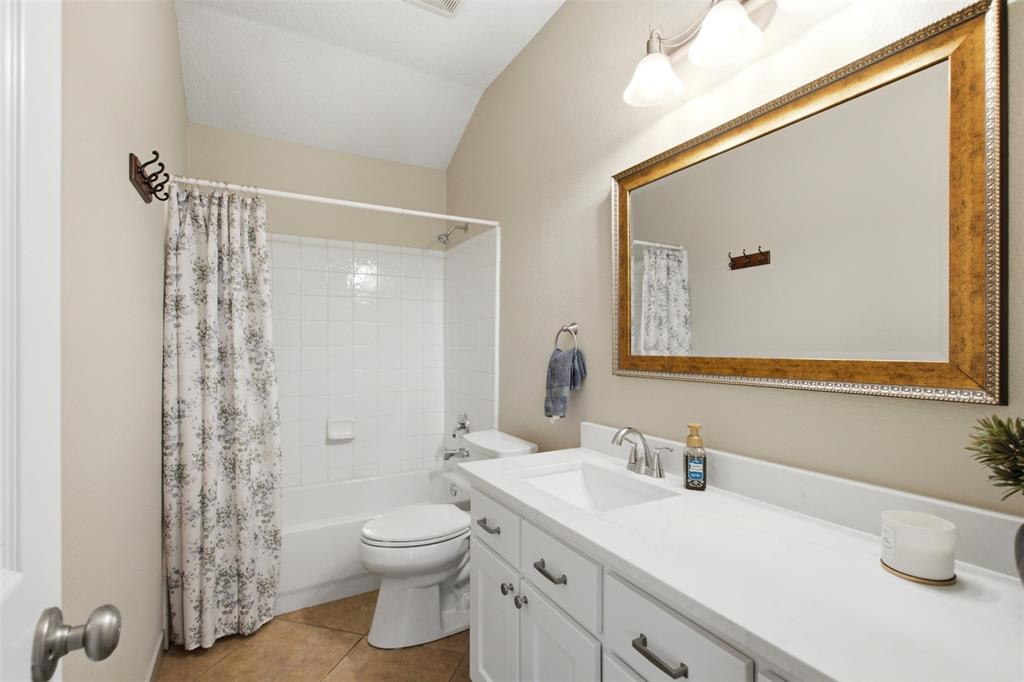 4218 Glistening Spring Rowlett, TX 75088 - Photo 30 of 39 Bathroom featuring an expansive vanity with a single basin, white cabinetry, and brushed nickel hardware