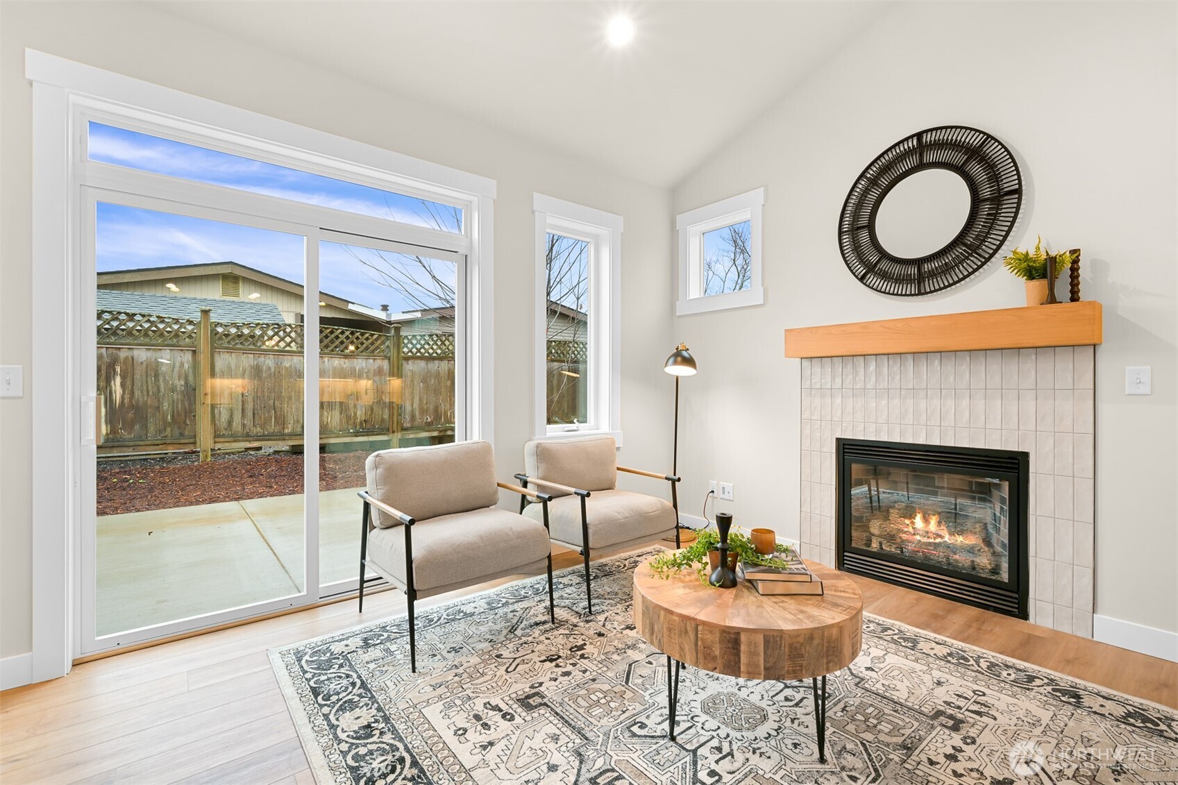 3993 Gentlebrook Lane, Unit 4 Bellingham, WA 98226 - Photo 15 of 27 a living room with furniture a window and a fireplace