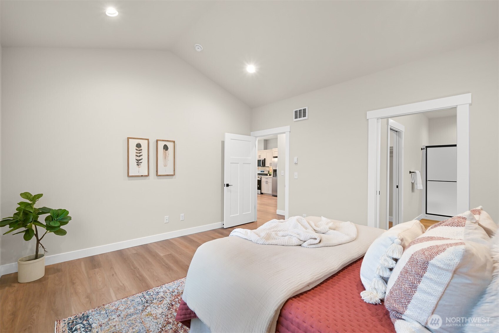 3993 Gentlebrook Lane, Unit 4 Bellingham, WA 98226 - Photo 20 of 27 a bedroom with a bed and a potted plant