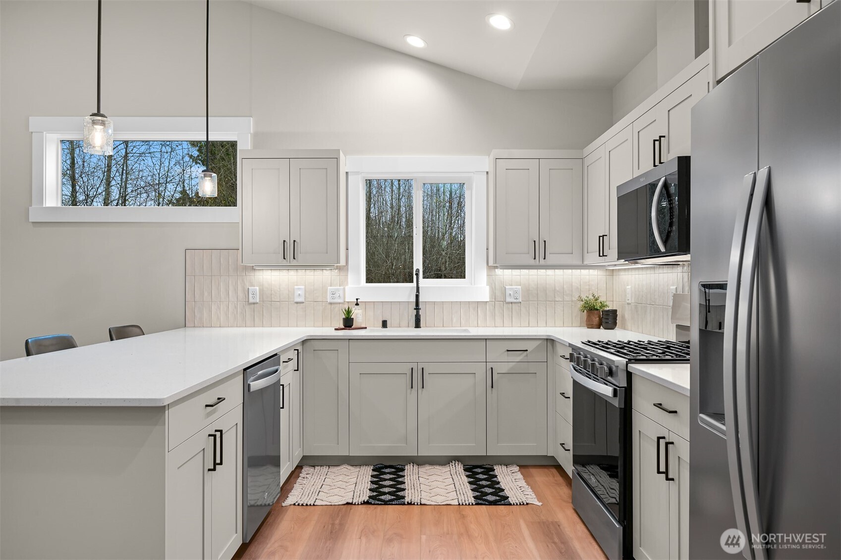 3993 Gentlebrook Lane, Unit 4 Bellingham, WA 98226 - Photo 2 of 27 a kitchen with a sink stove and refrigerator