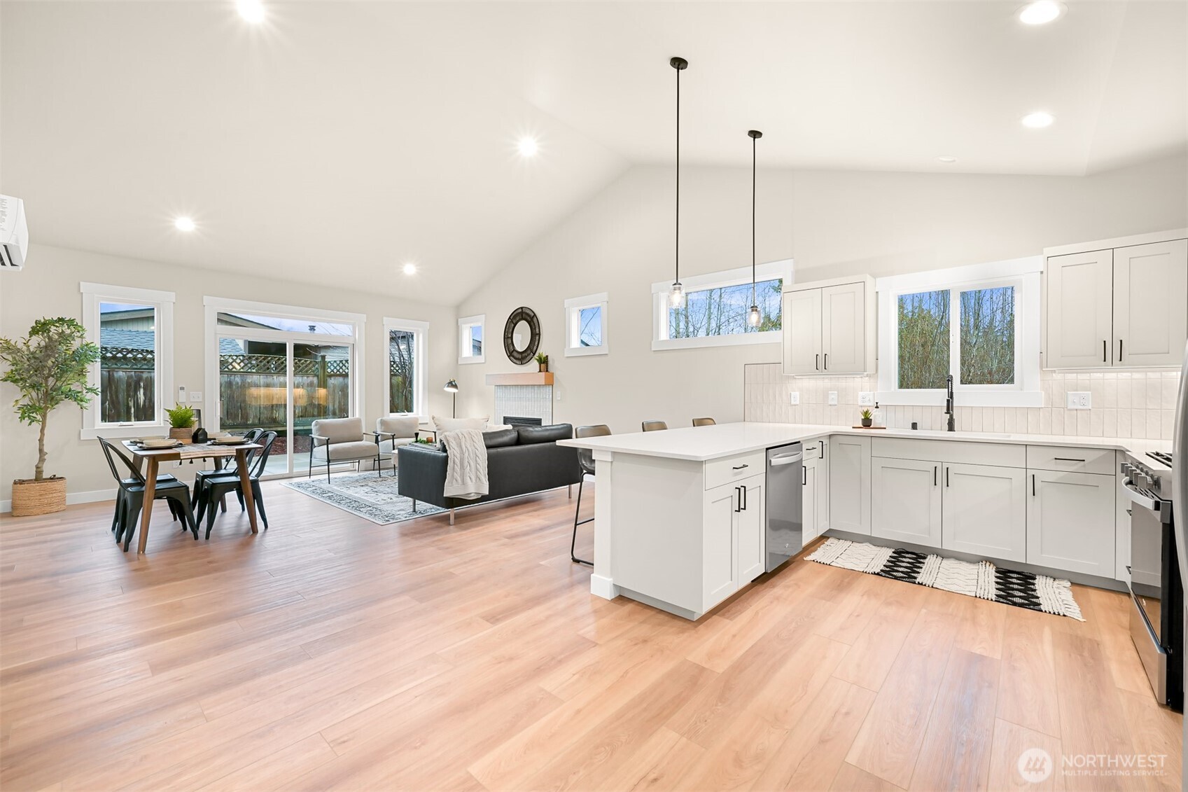 3993 Gentlebrook Lane, Unit 4 Bellingham, WA 98226 - Photo 7 of 27 a large white kitchen with sink and cabinets