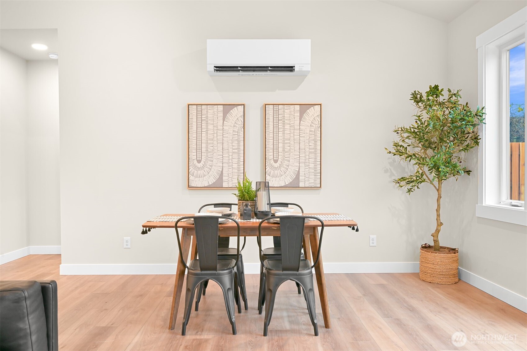 3993 Gentlebrook Lane, Unit 4 Bellingham, WA 98226 - Photo 9 of 27 a view of a dining room with furniture and a potted plant