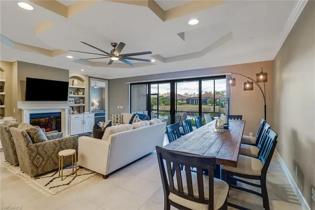 a living room with fireplace furniture and a flat screen tv