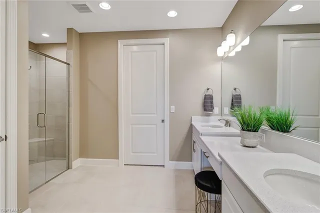 a room with a sink and a mirror