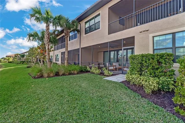 a view of a house with a yard and plants