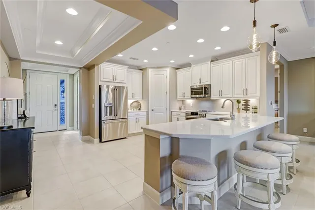 a kitchen with a sink cabinets and stainless steel appliances