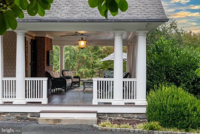 a view of porch with a bench