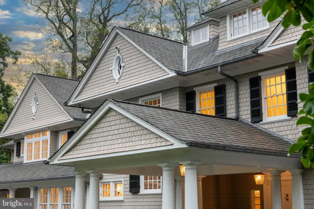 a living room with furniture large window and a fireplace