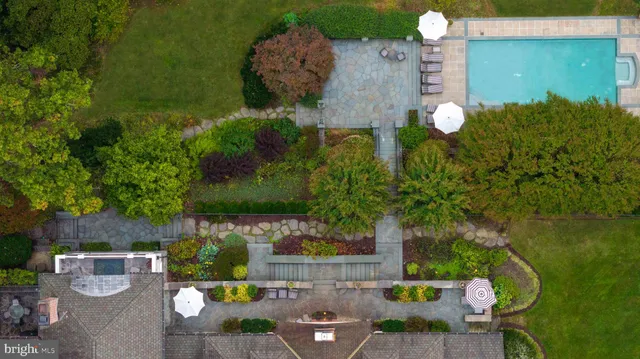 an aerial view of a house with outdoor space