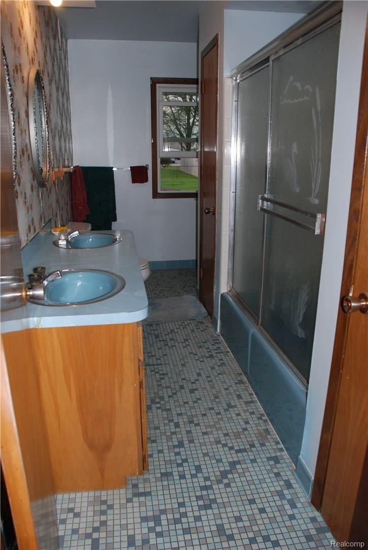 403 Trombley Road Troy, MI 48083 - Photo 10 of 10 LARGE BATHROOM, DUAL LINEN CLOSETS, VANITY AND DUAL SINKS