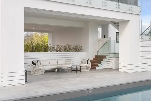 a view of a room with wooden floor and windows