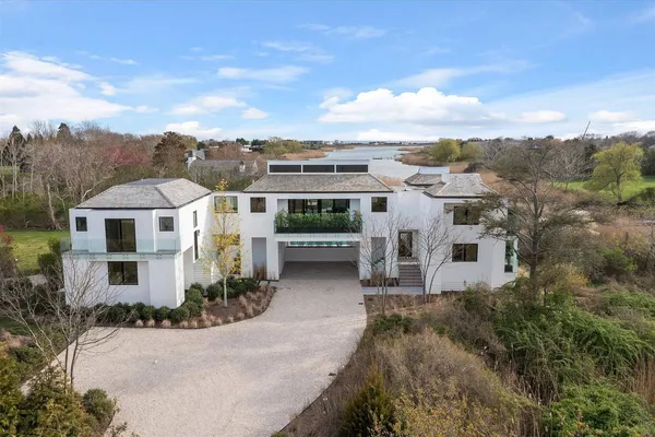 an aerial view of a house with a yard