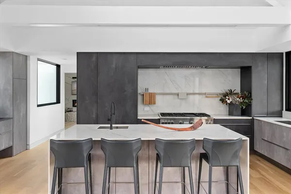 a kitchen with a table and chairs in it