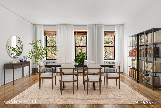a view of a a dining room with furniture window and wooden floor