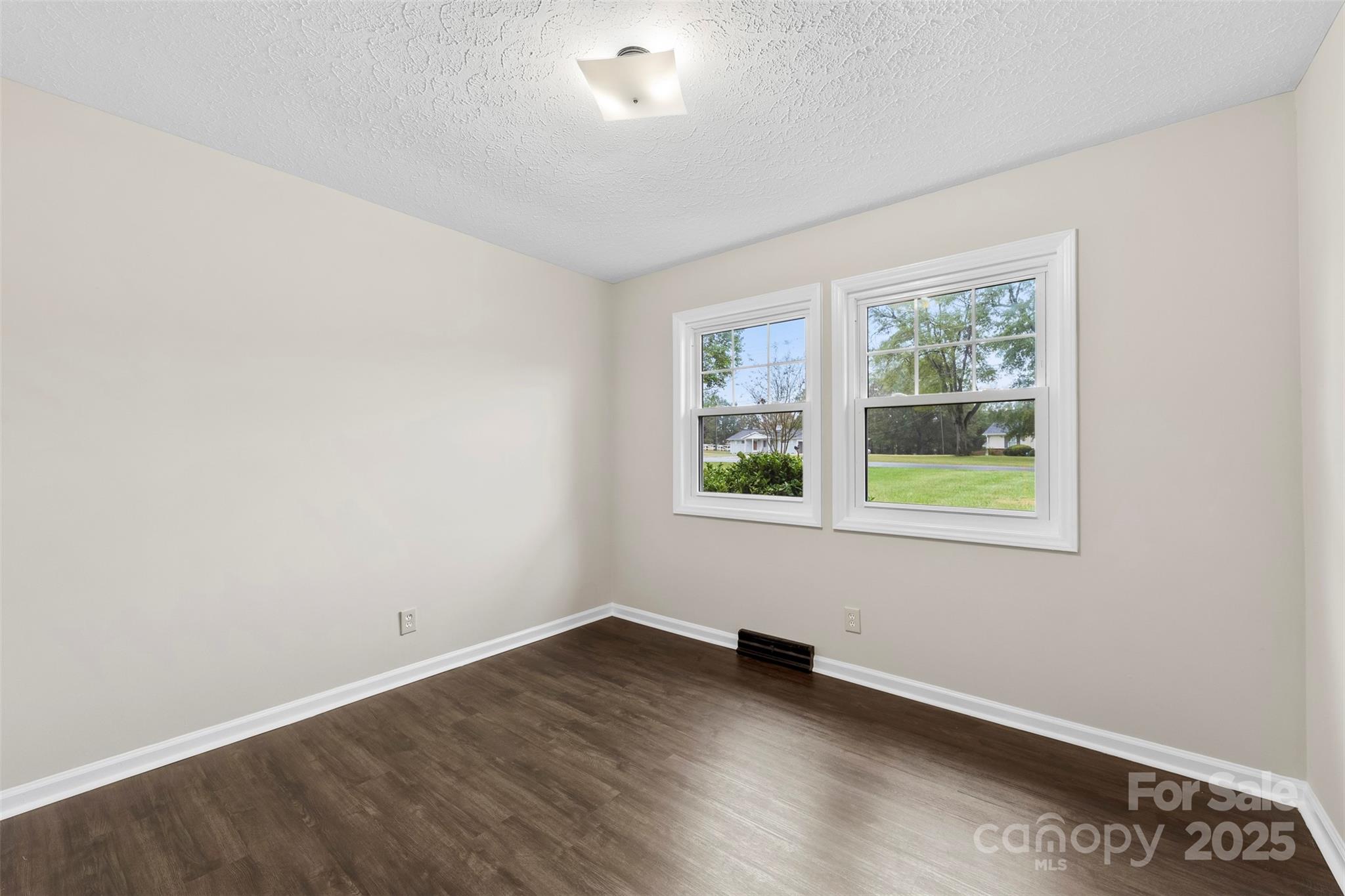 404 James Love School Road Shelby, NC 28152 - Photo 13 of 25 an empty room with wooden floor and windows