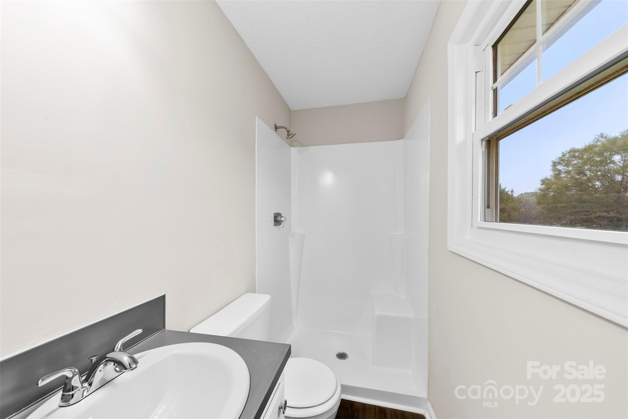 404 James Love School Road Shelby, NC 28152 - Photo 18 of 25 a bathroom with a sink toilet and shower