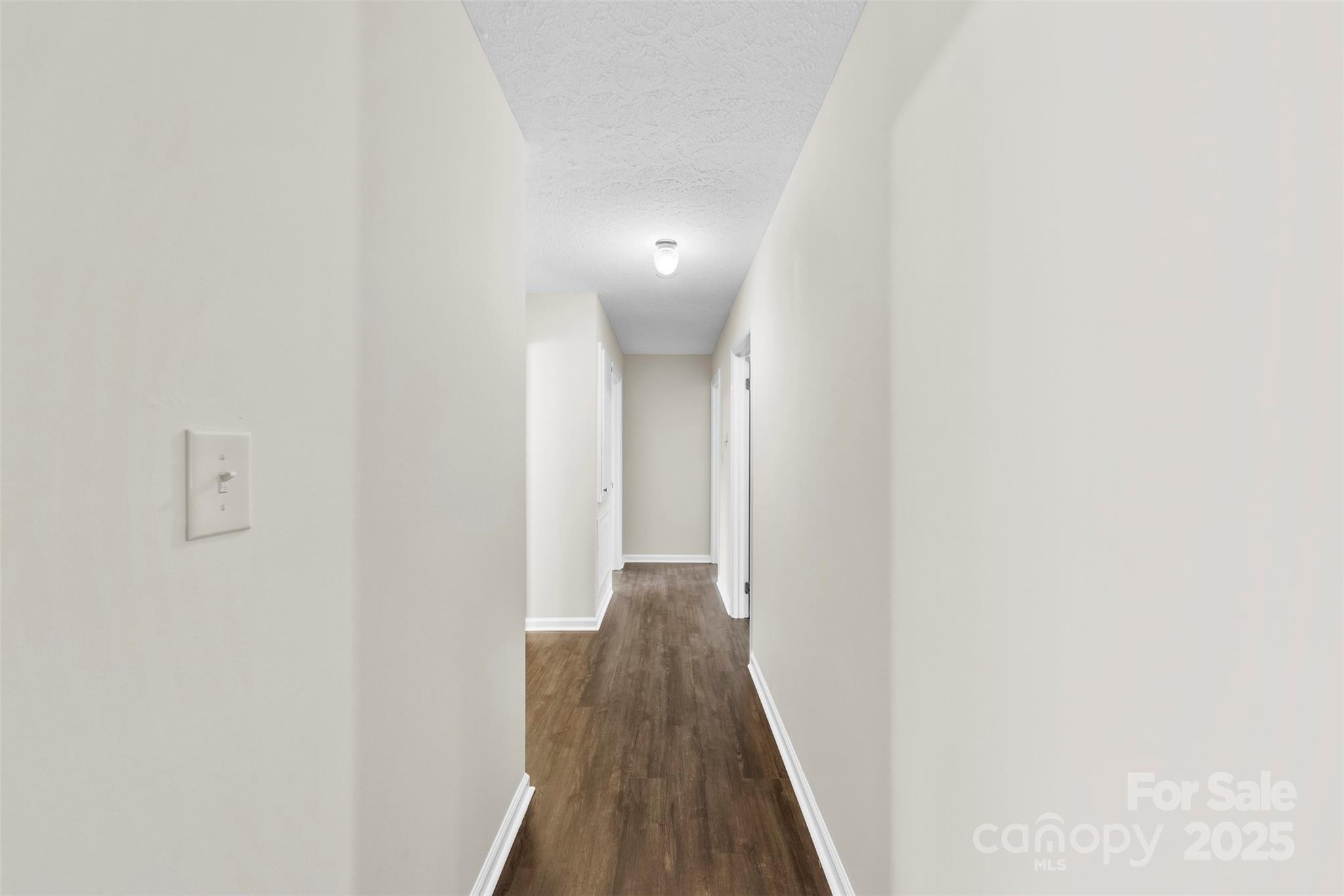 404 James Love School Road Shelby, NC 28152 - Photo 19 of 25 a view of a hallway with wooden floor