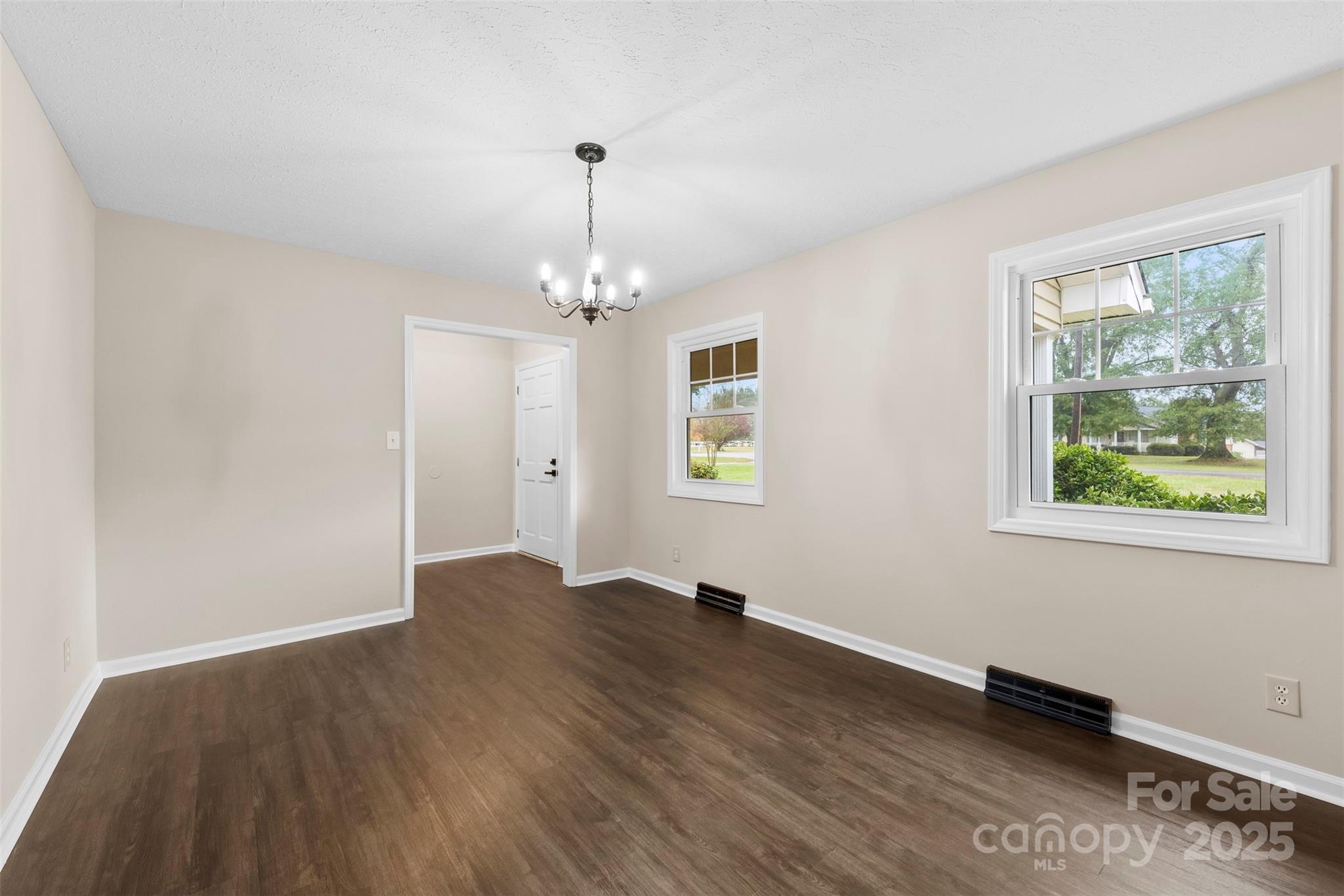 404 James Love School Road Shelby, NC 28152 - Photo 3 of 25 a view of empty room with wooden floor and window