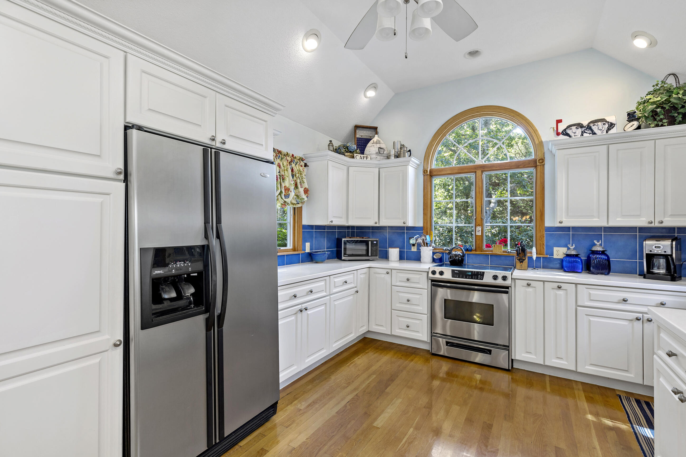 60 Turnip Field Road Eastham, MA 02642 - Photo 11 of 57 a kitchen with a refrigerator a sink stainless steel appliances and cabinets