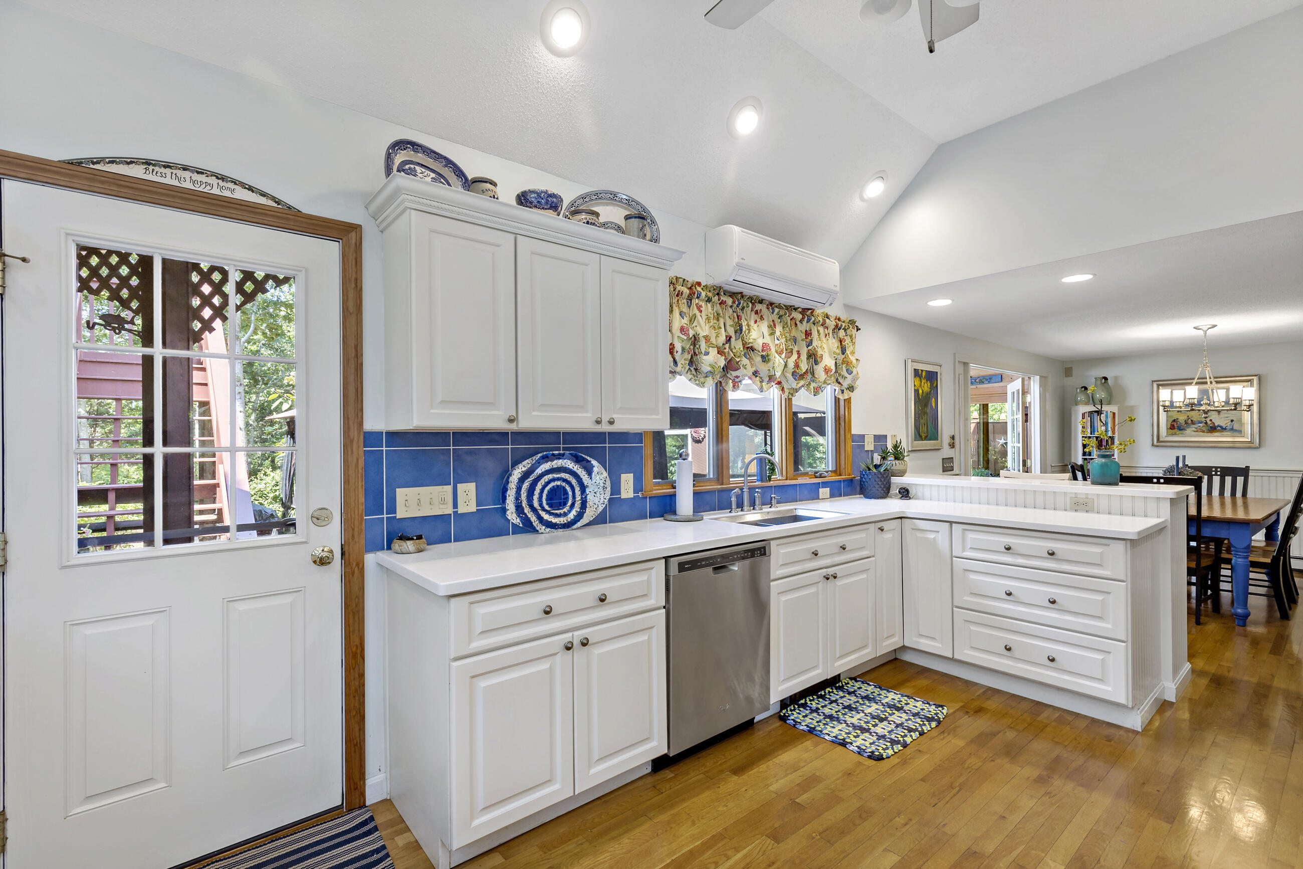 60 Turnip Field Road Eastham, MA 02642 - Photo 14 of 57 a kitchen that has a lot of cabinets in it and wooden floor
