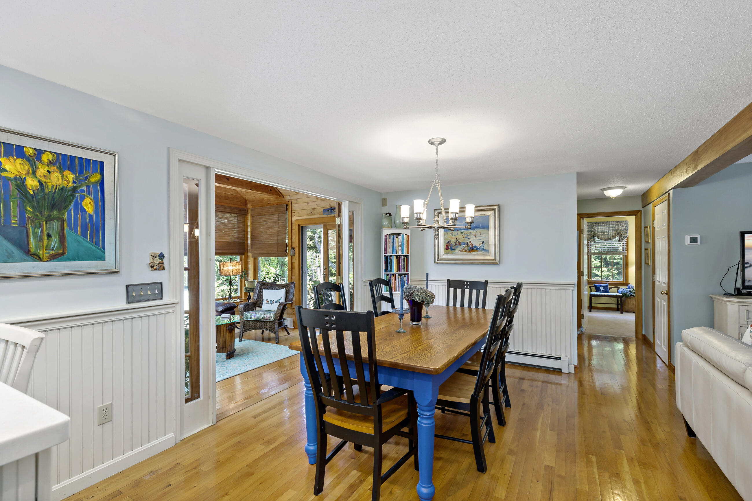 60 Turnip Field Road Eastham, MA 02642 - Photo 16 of 57 a view of a dining room with furniture and wooden floor