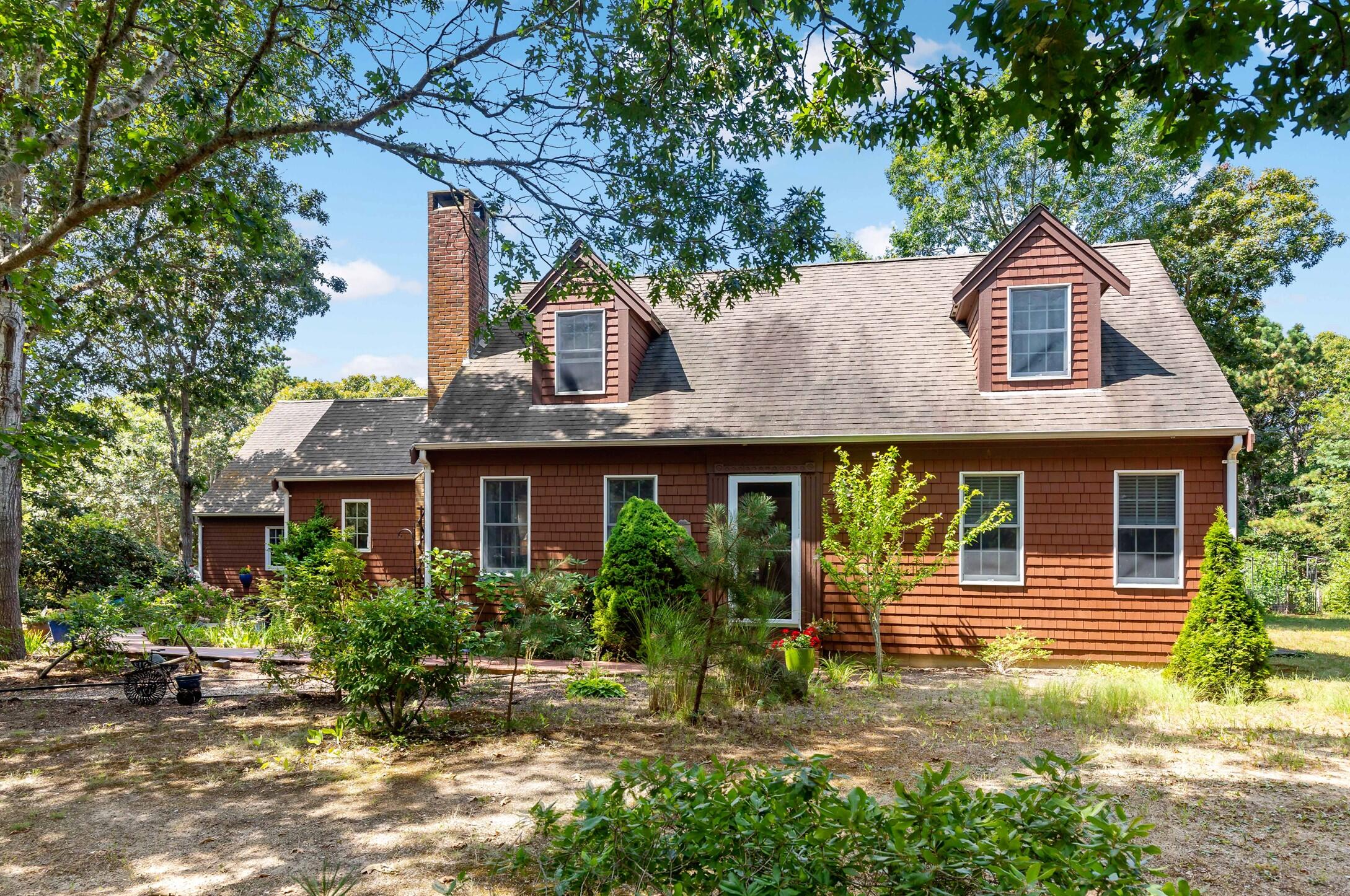 60 Turnip Field Road Eastham, MA 02642 - Photo 2 of 57 a front view of a house with garden