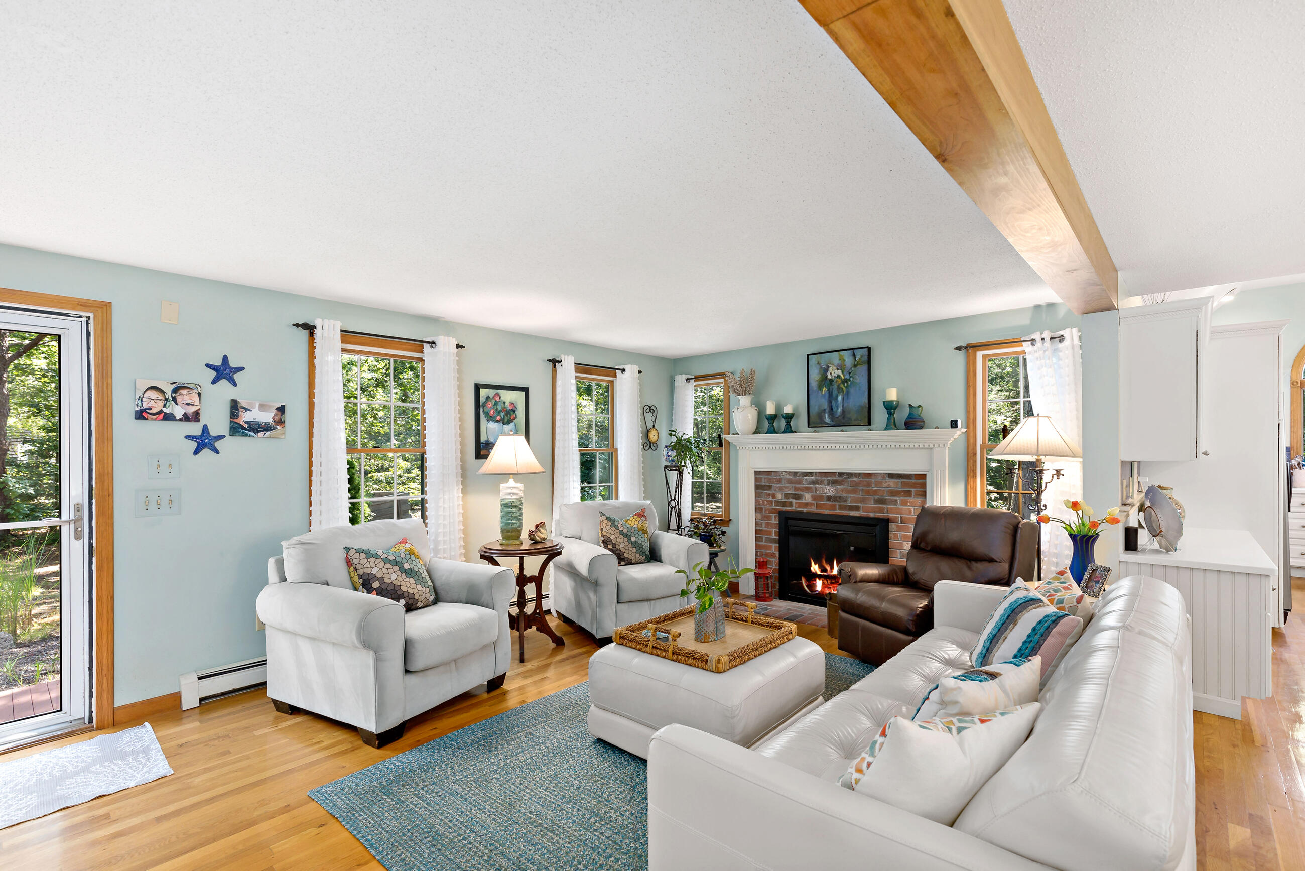 60 Turnip Field Road Eastham, MA 02642 - Photo 22 of 57 a living room with furniture and a fireplace