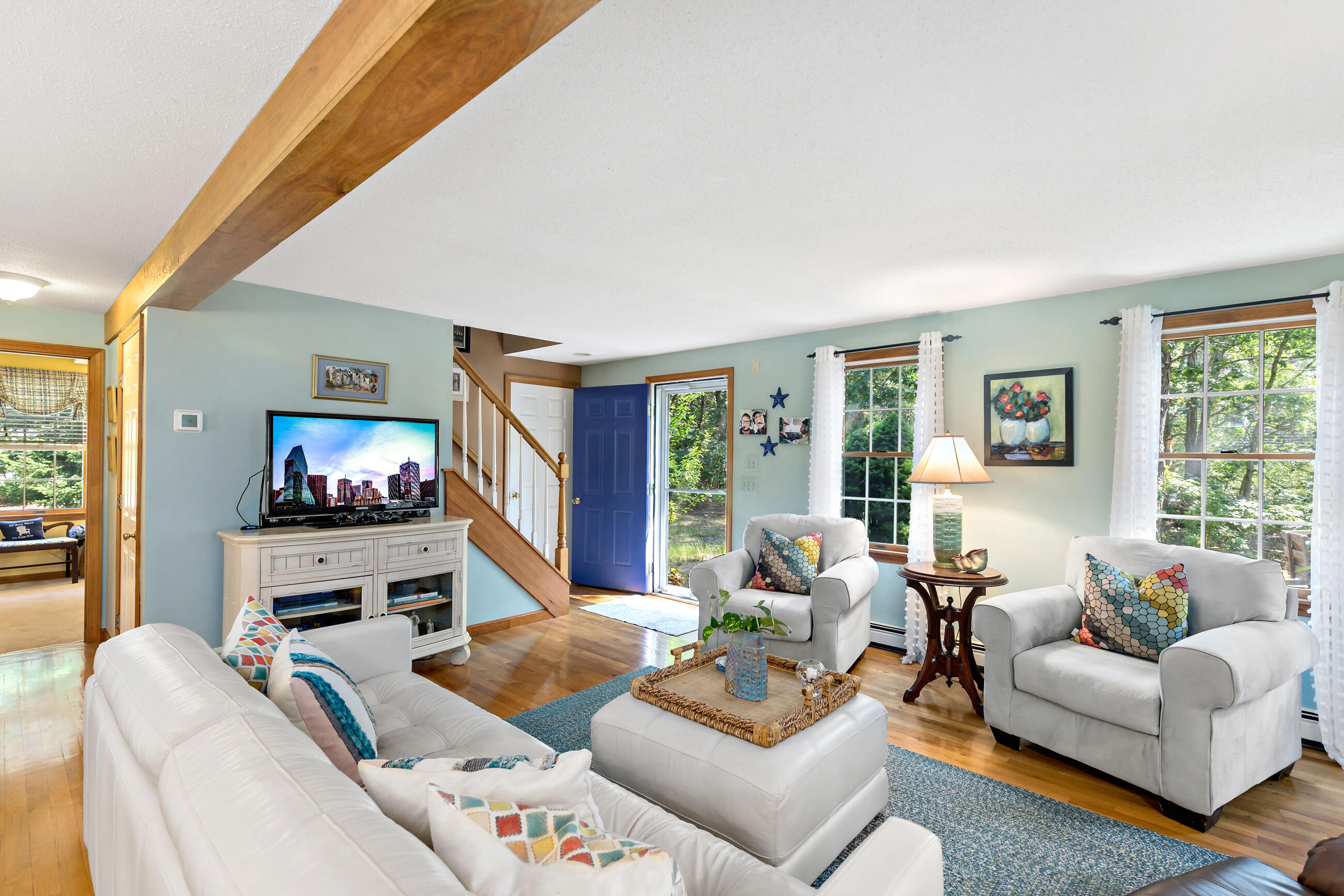 60 Turnip Field Road Eastham, MA 02642 - Photo 25 of 57 a living room with furniture and a flat screen tv