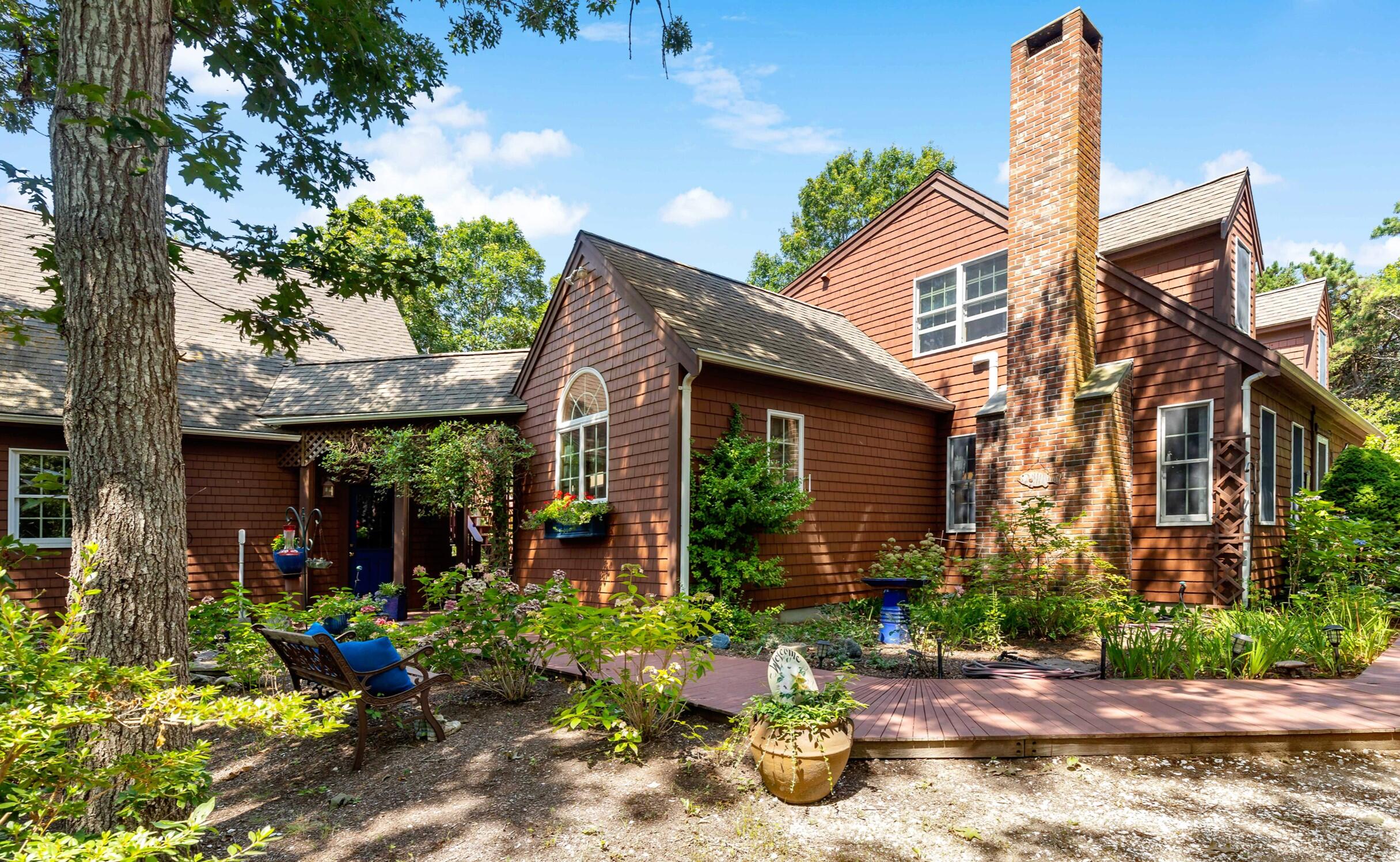 60 Turnip Field Road Eastham, MA 02642 - Photo 3 of 57 a front view of a house with garden