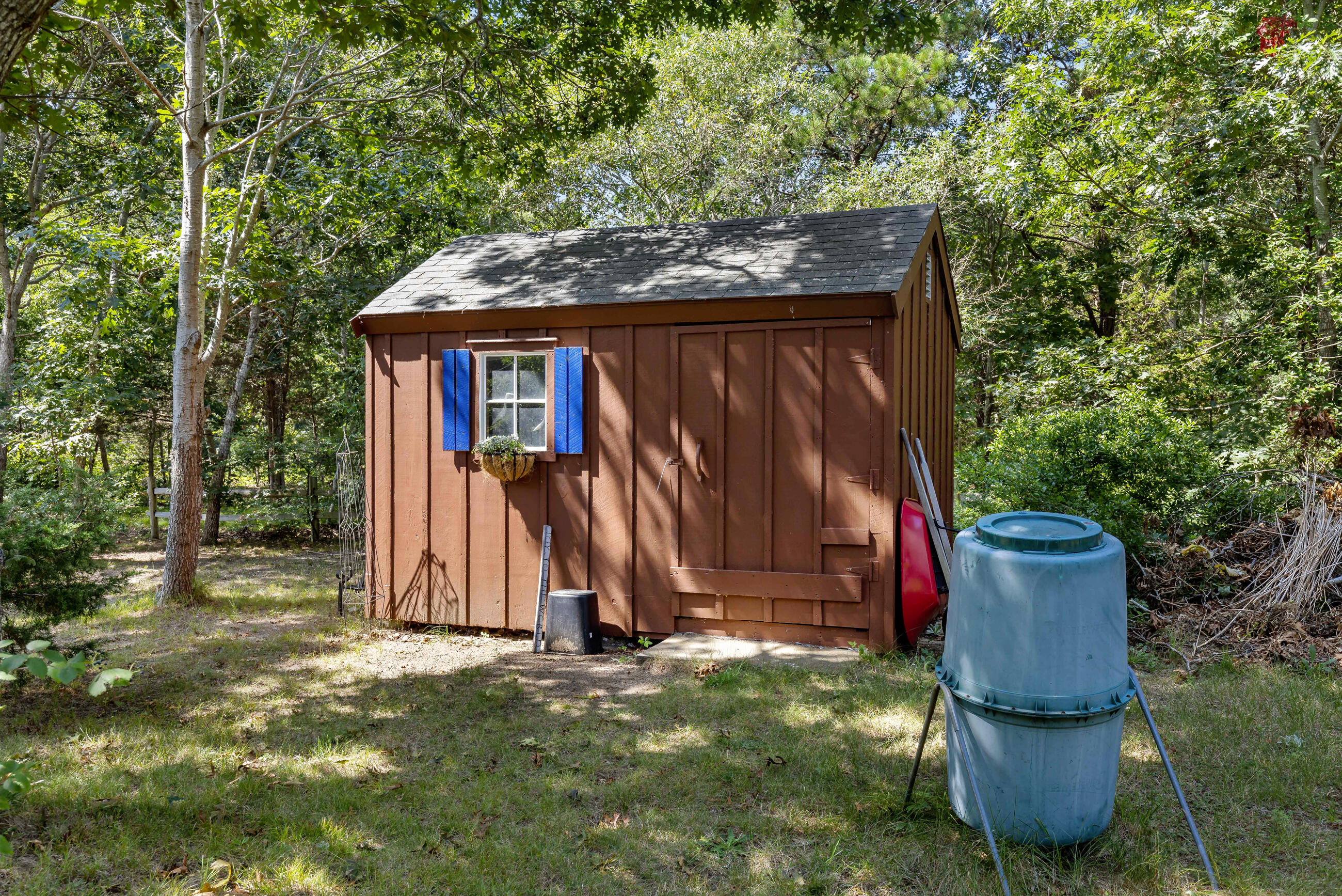 60 Turnip Field Road Eastham, MA 02642 - Photo 44 of 57 a backyard of a house with table and chairs
