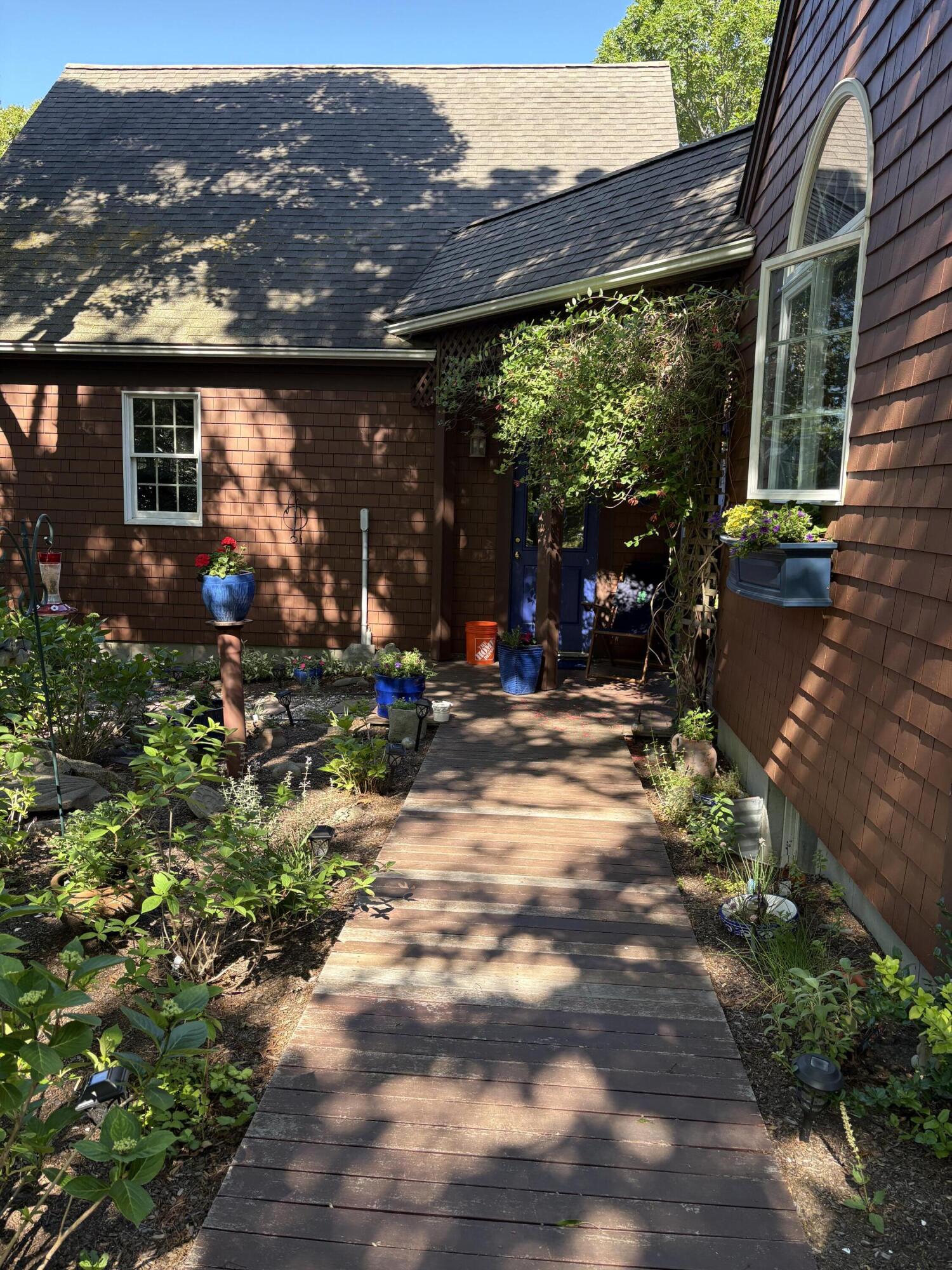 60 Turnip Field Road Eastham, MA 02642 - Photo 48 of 57 a view of a house with yard and sitting area