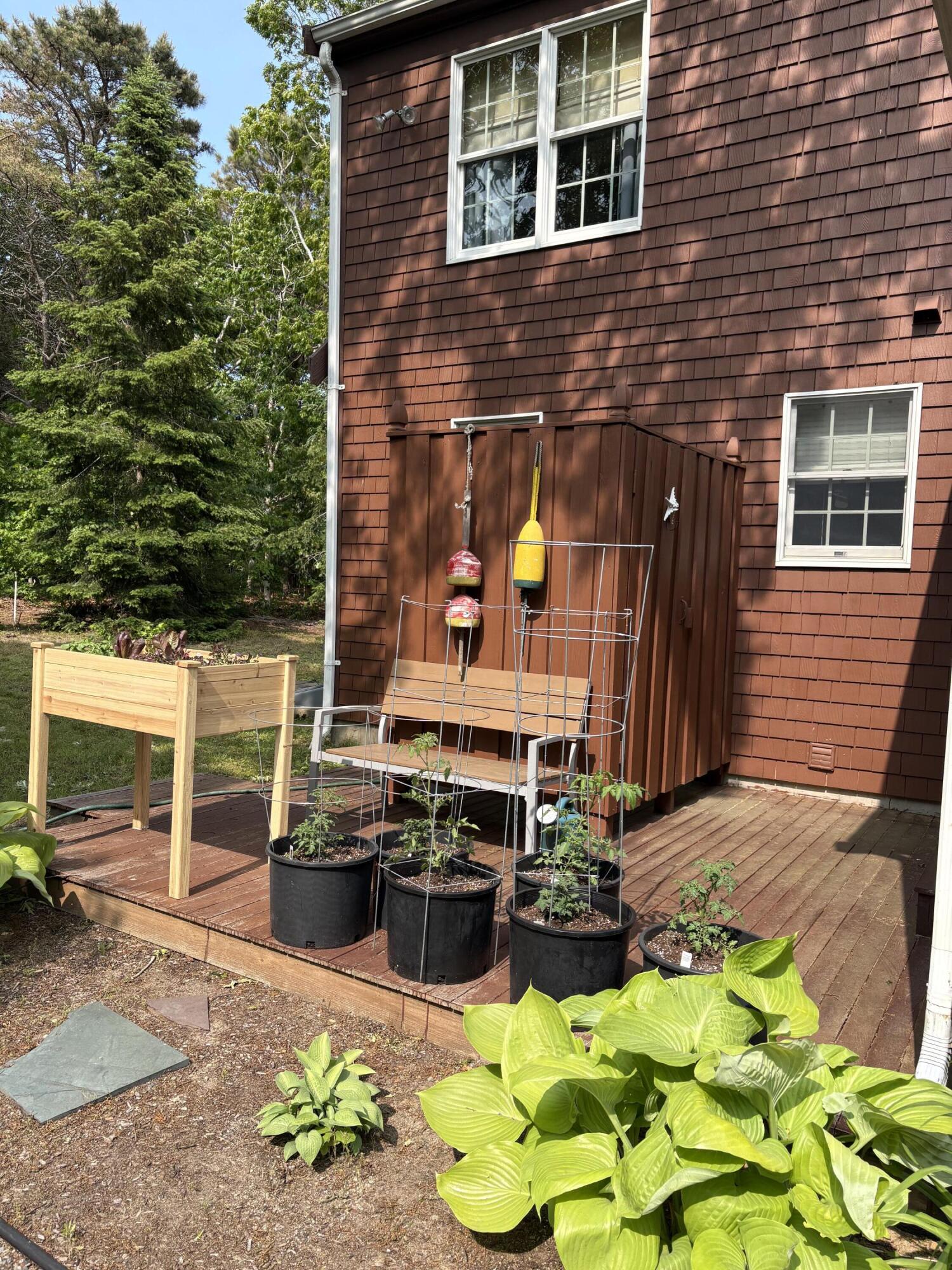 60 Turnip Field Road Eastham, MA 02642 - Photo 49 of 57 a view of a chairs and table in the patio