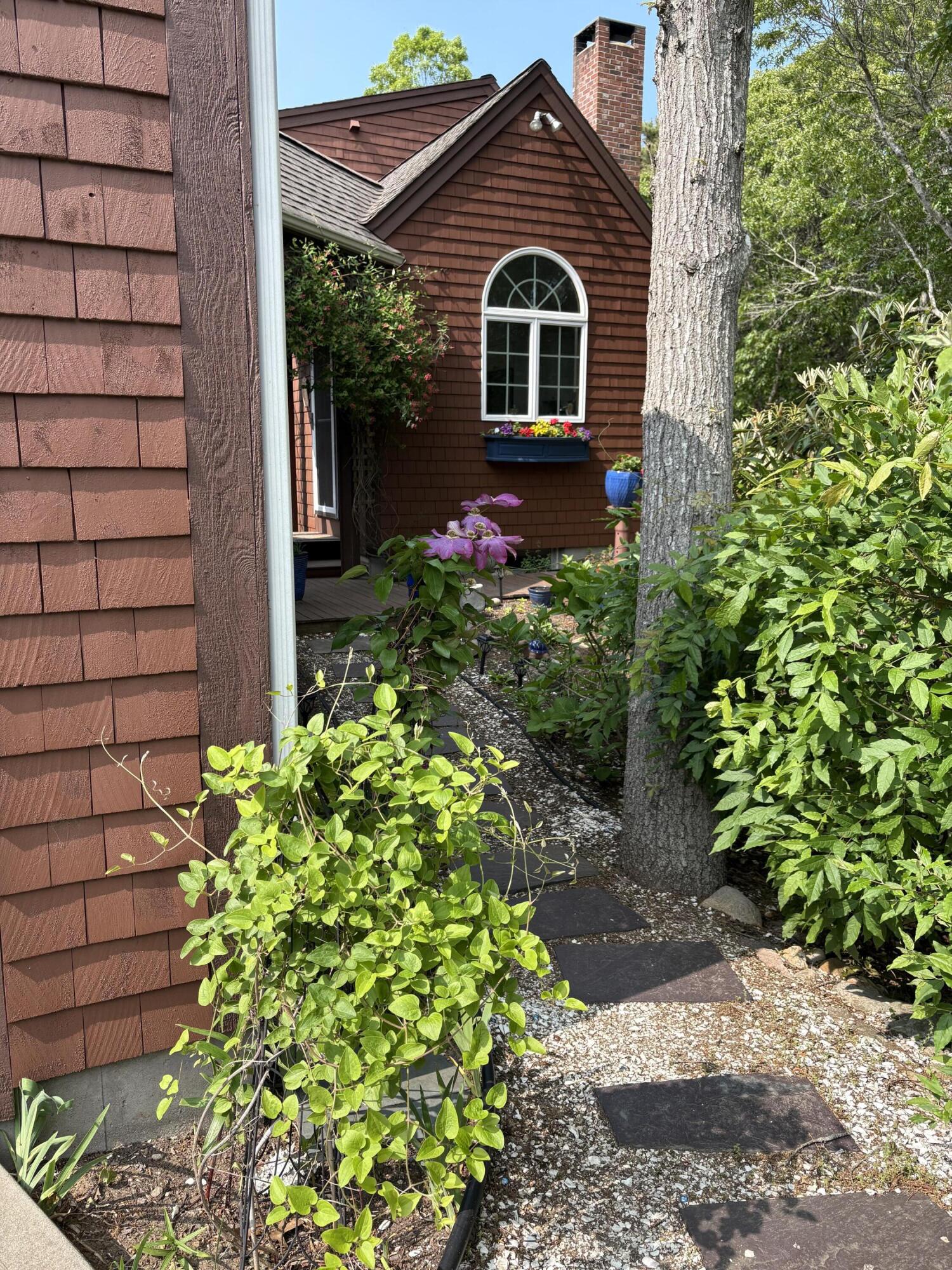 60 Turnip Field Road Eastham, MA 02642 - Photo 50 of 57 a front view of a house with a yard