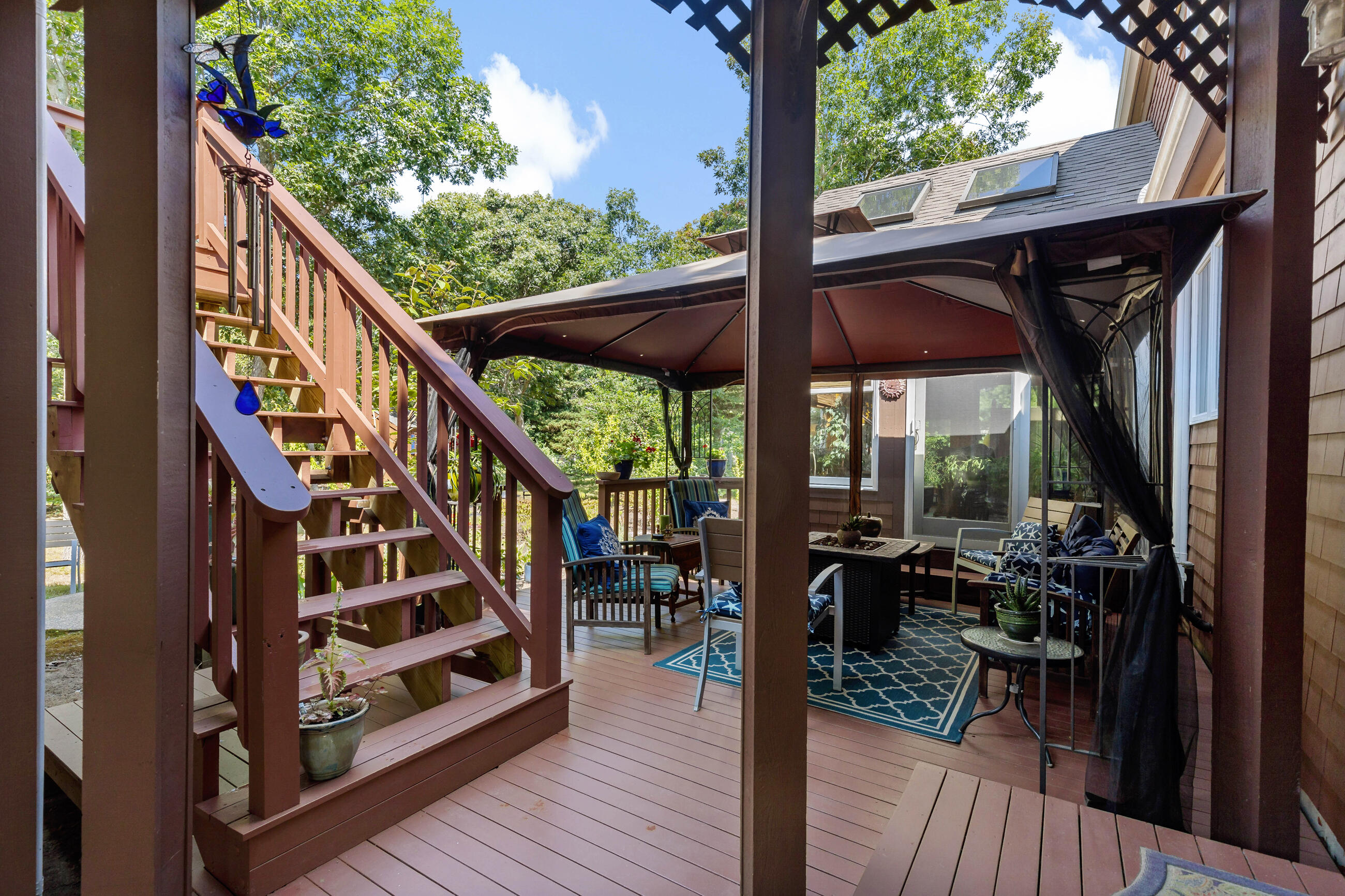 60 Turnip Field Road Eastham, MA 02642 - Photo 5 of 57 a view of balcony with chairs and wooden floor