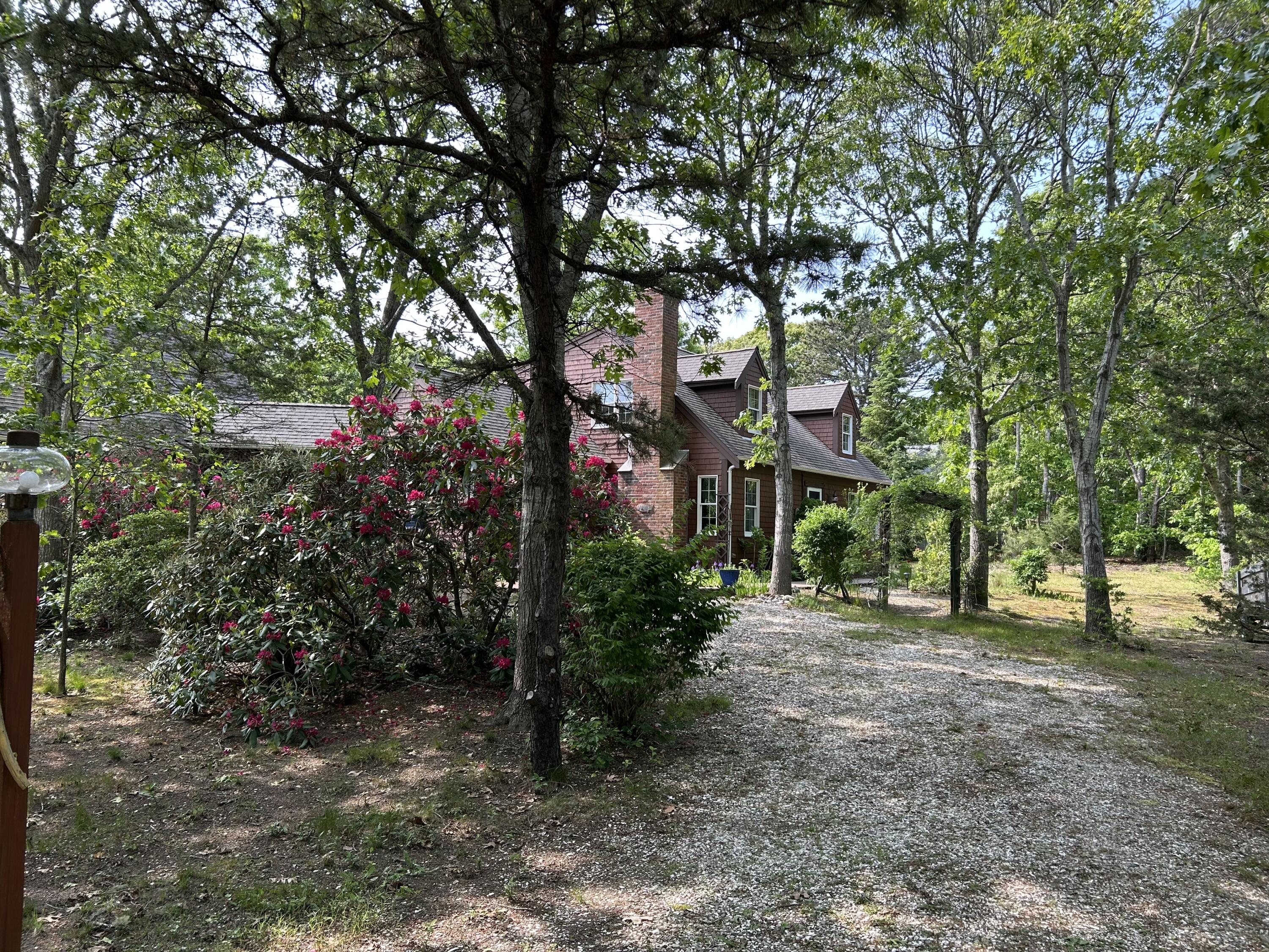 60 Turnip Field Road Eastham, MA 02642 - Photo 53 of 57 a sign board with large trees
