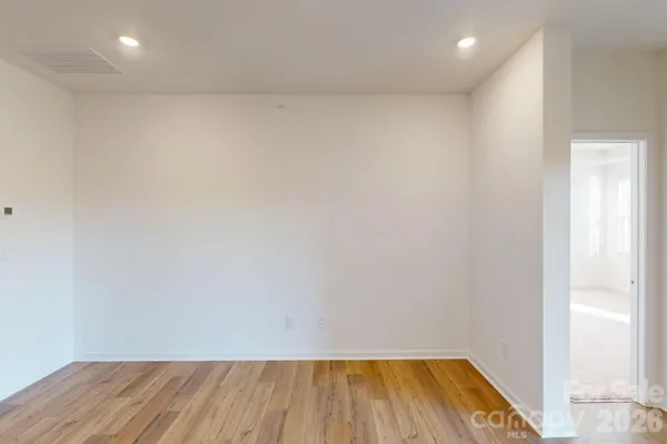 a view of room with wooden floor