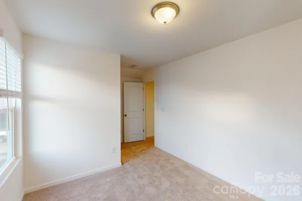 a view of an house with backyard and swimming pool