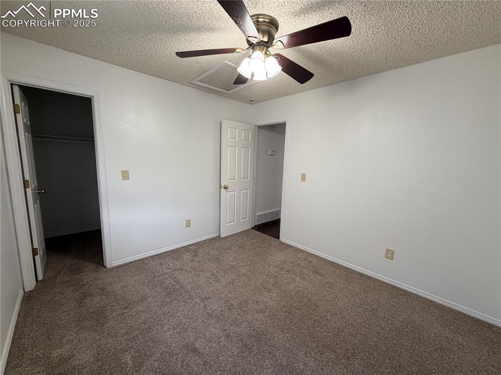 770 Memory Lane Fountain, CO 80817 - Photo 13 of 21 an empty room with a ceiling fan and a fan