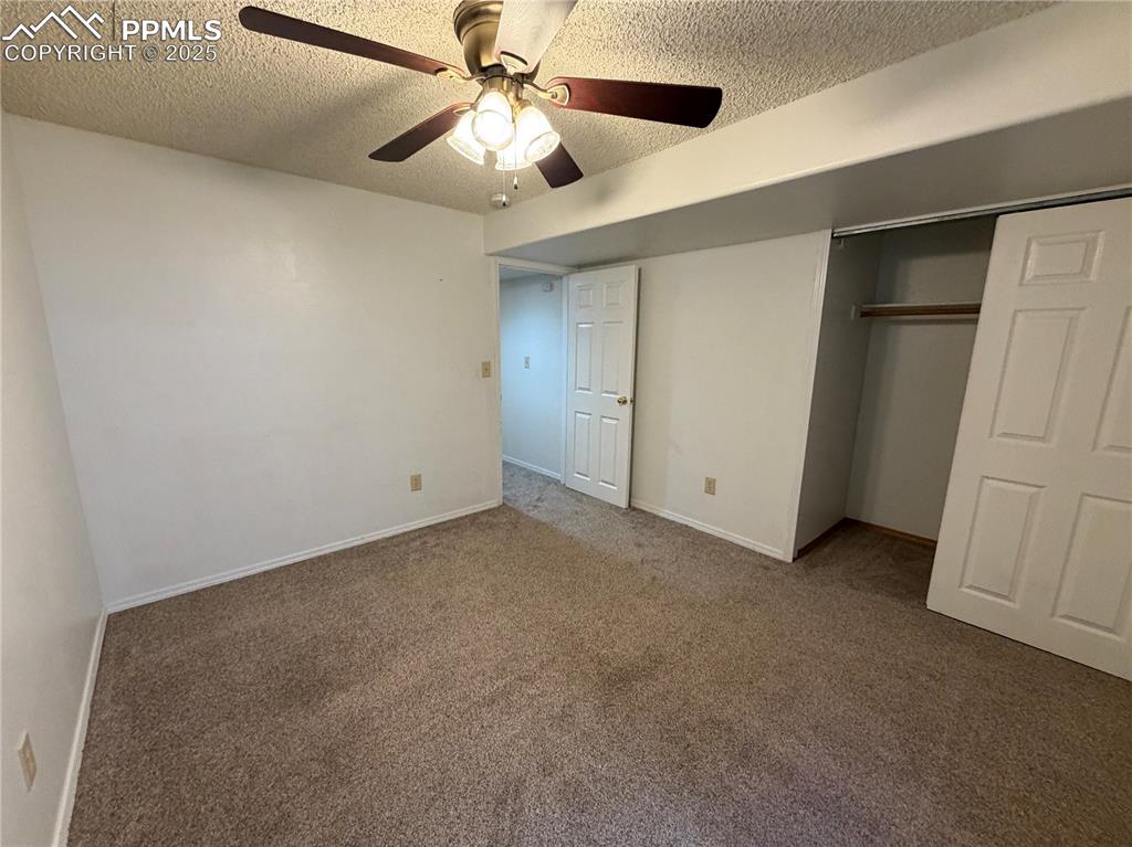 770 Memory Lane Fountain, CO 80817 - Photo 19 of 21 an empty room with closet and a ceiling fan