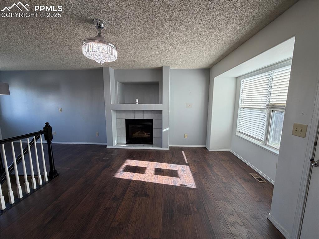 770 Memory Lane Fountain, CO 80817 - Photo 3 of 21 a view of an empty room with window and fire place