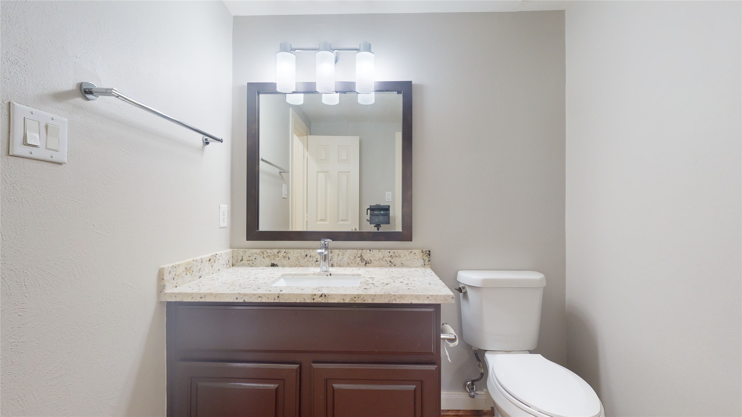 328 Malone Street Houston, TX 77007 - Photo 11 of 50 a bathroom with a toilet sink and mirror