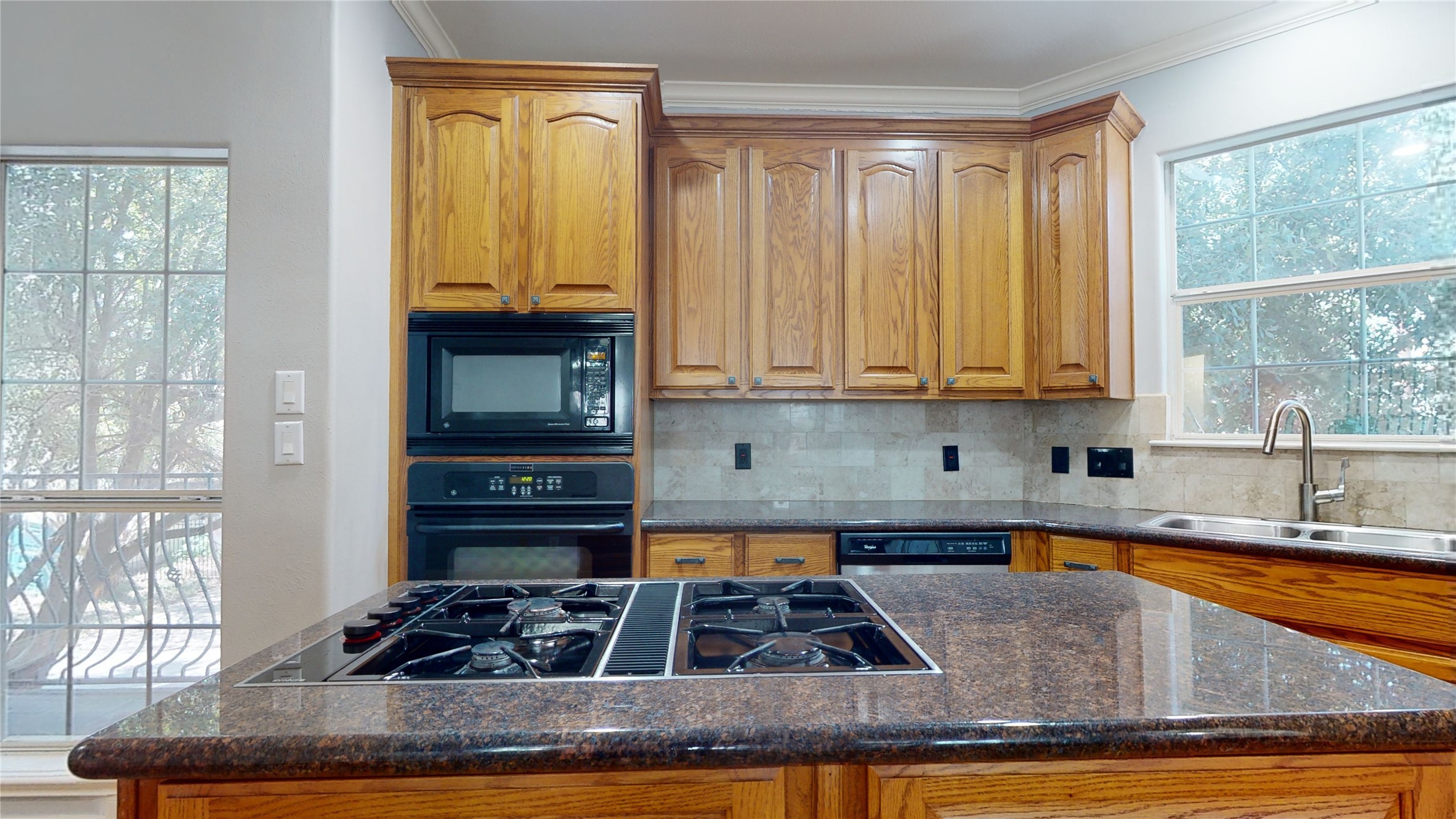 328 Malone Street Houston, TX 77007 - Photo 24 of 50 a kitchen with stainless steel appliances granite countertop a stove a sink and a granite counter tops