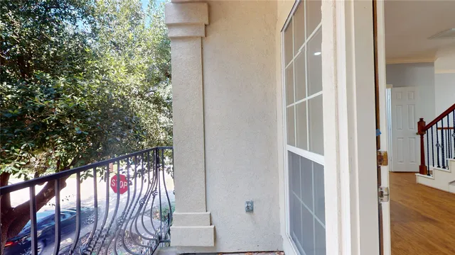 a view of a house with a tree