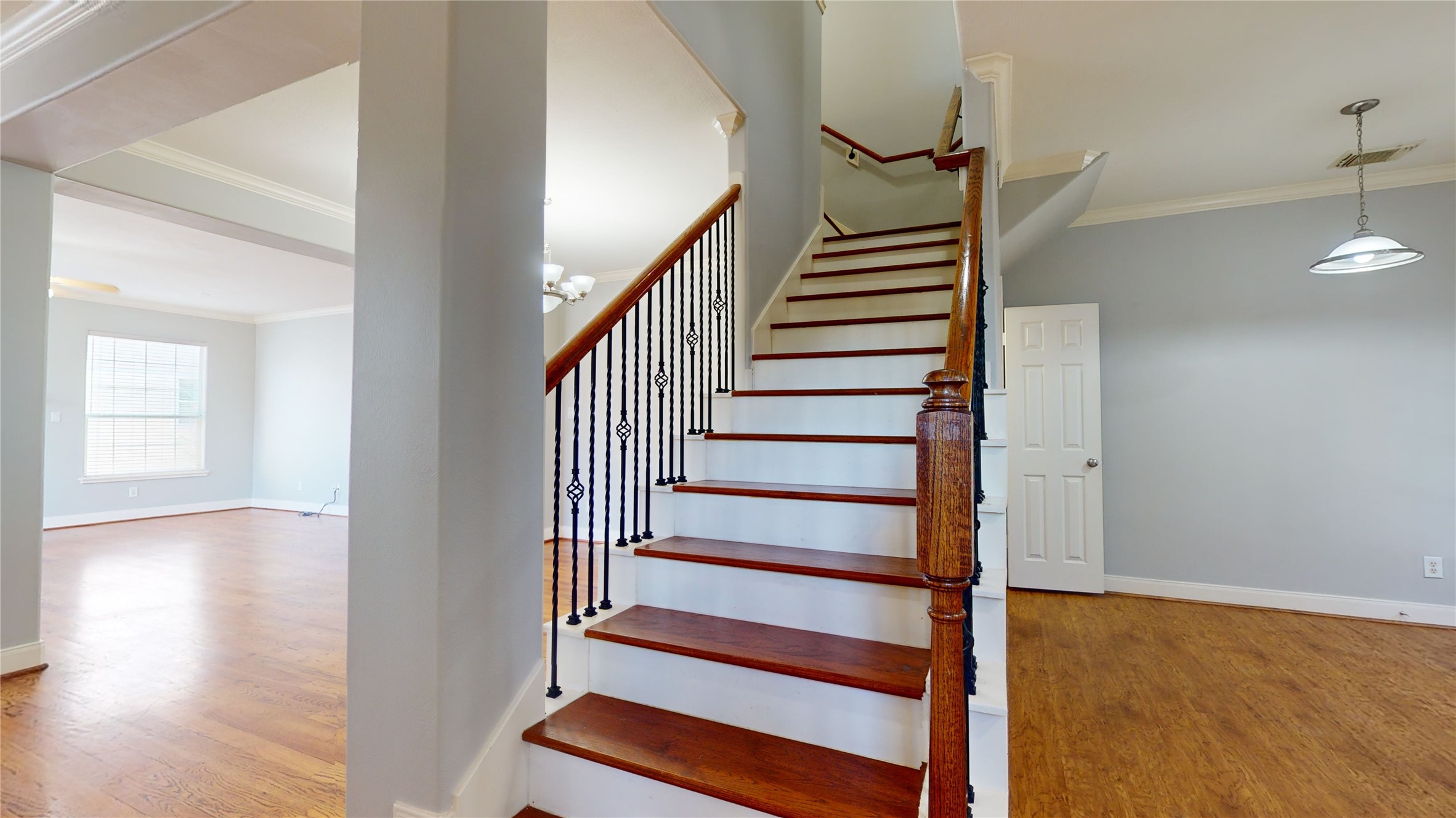 328 Malone Street Houston, TX 77007 - Photo 32 of 50 a view of entryway with wooden floor and stairs