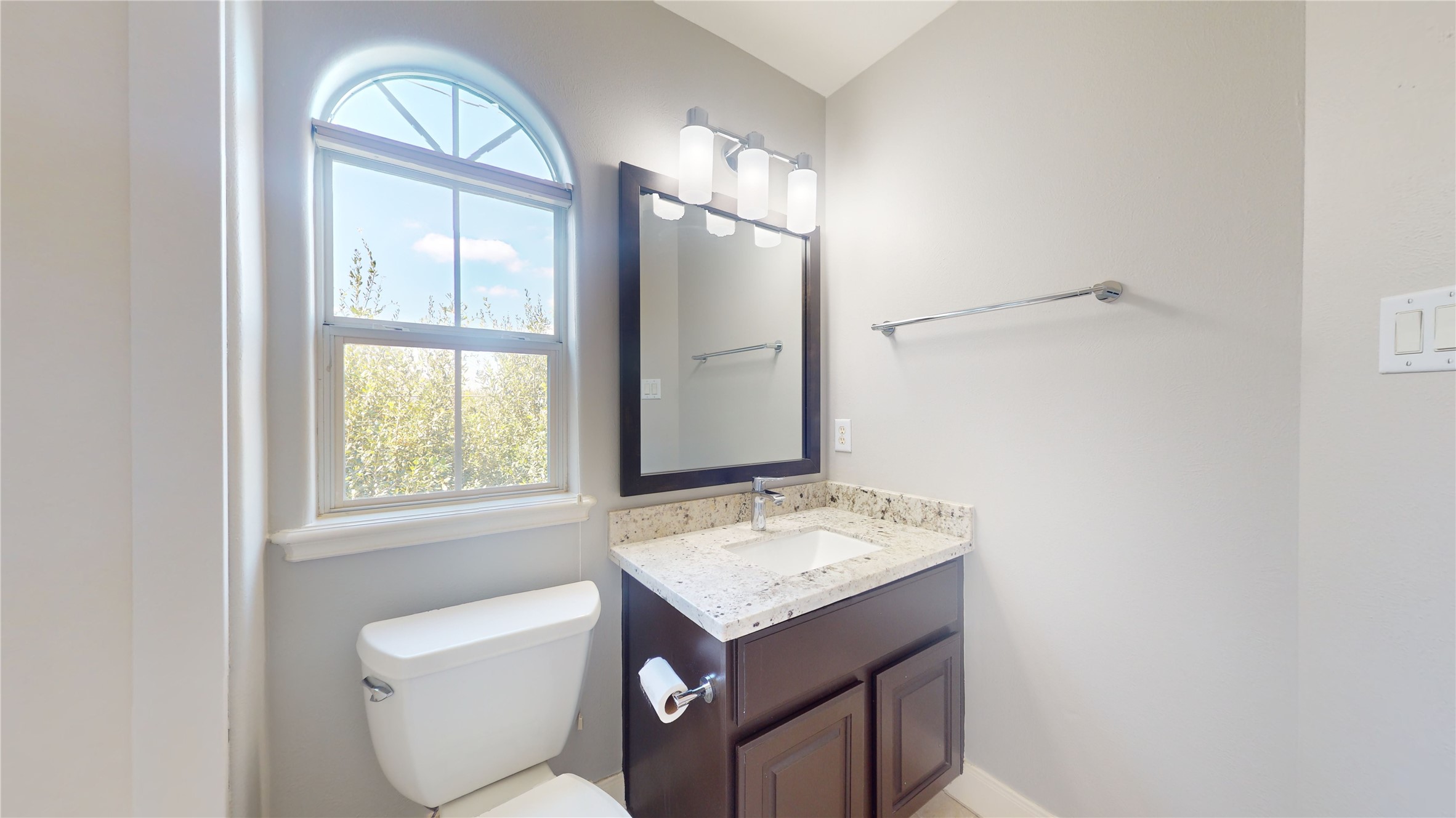 328 Malone Street Houston, TX 77007 - Photo 48 of 50 a bathroom with a granite countertop sink toilet and a mirror
