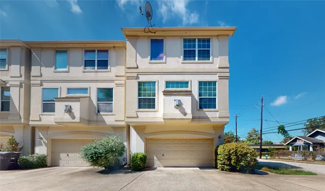 a front view of a house with parking