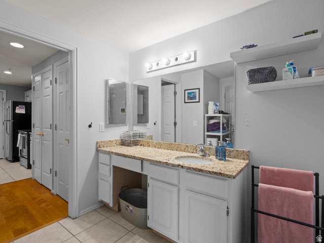 900 Bitner Road, Unit D 34 Park City, UT 84098 - Photo 17 of 25 Bathroom featuring light tile patterned floors, vanity, and a closet
