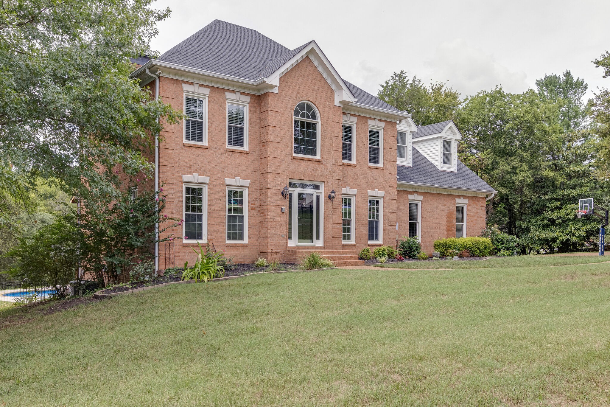 211 Hillside Drive Franklin, TN 37067 - Photo 2 of 43 a front view of a house with a yard