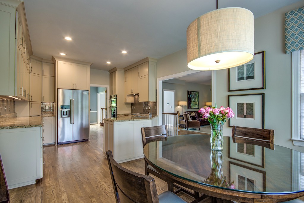 211 Hillside Drive Franklin, TN 37067 - Photo 11 of 43 a kitchen with a refrigerator and a dining table