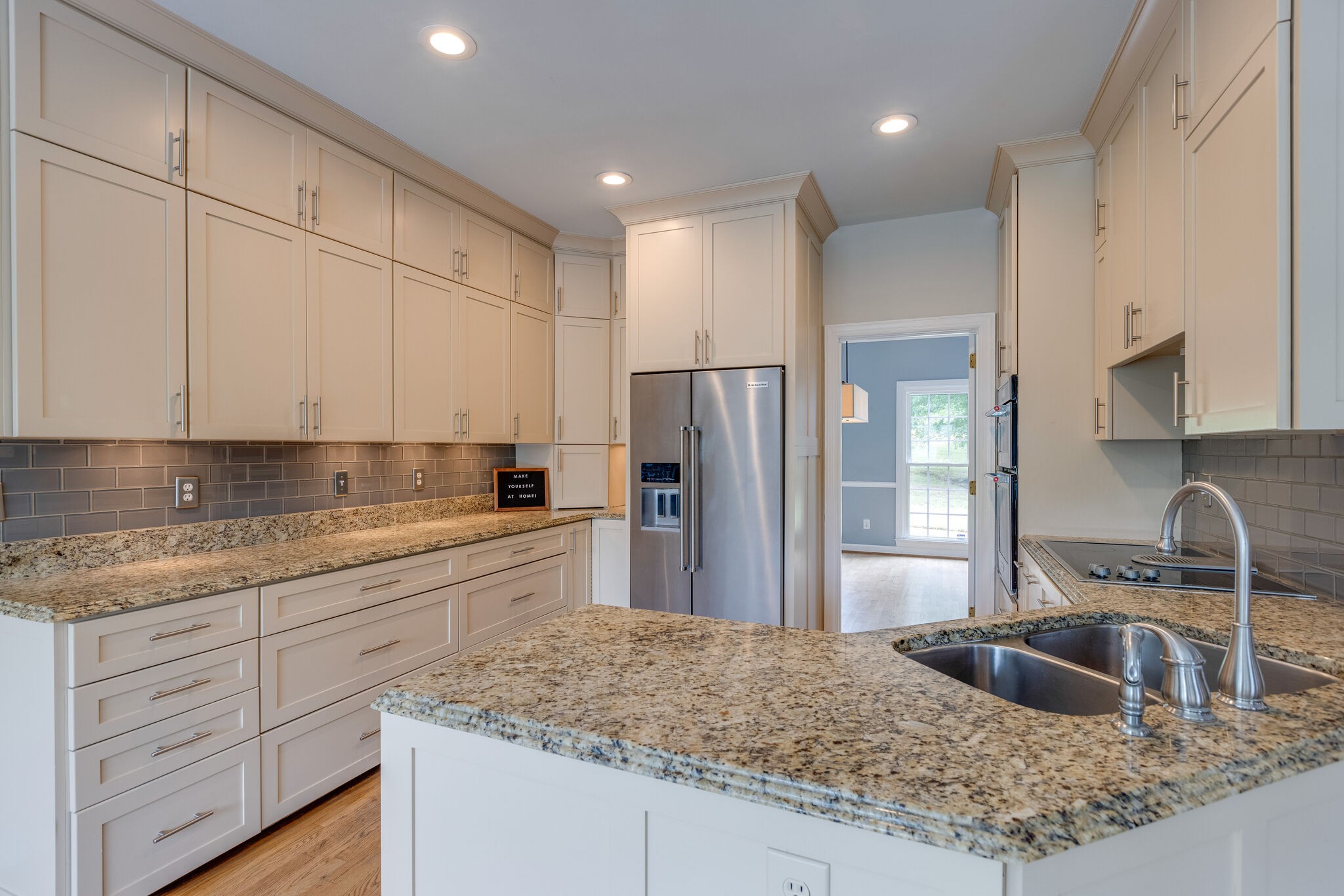 211 Hillside Drive Franklin, TN 37067 - Photo 12 of 43 a kitchen with stainless steel appliances granite countertop a sink stove and refrigerator